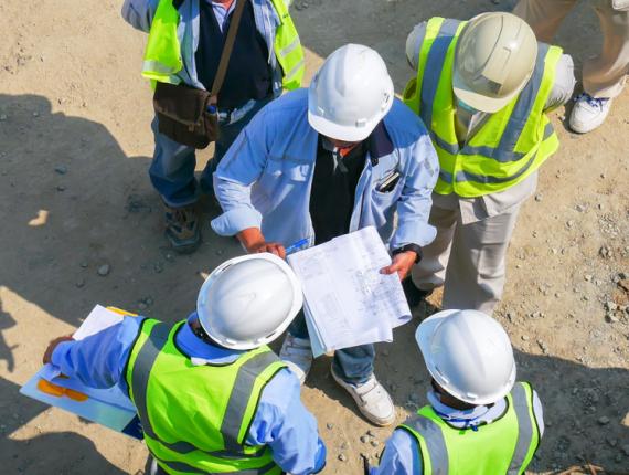 workers outside talking together