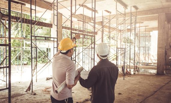 Two contractors on a building site