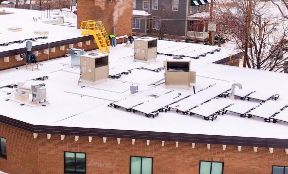A snow filled roof with RTUs